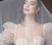 Bride wearing a cathedral-length wedding veil, perfect for a formal ceremony.