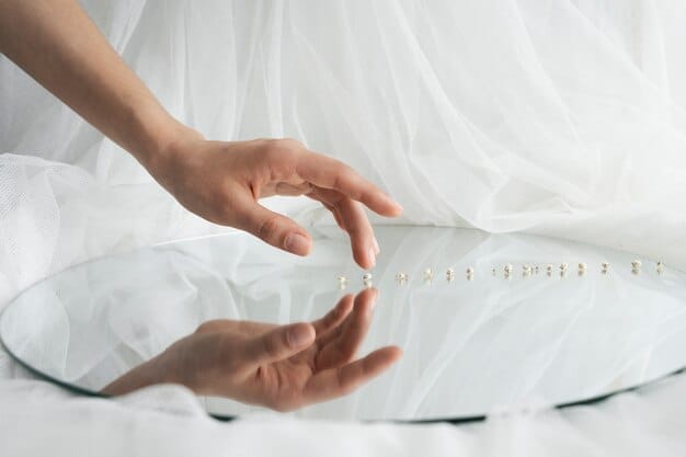 An artisan handcrafting a wedding veil with intricate details.